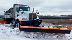 City of Redwood Falls Plow truck pushing snow on road