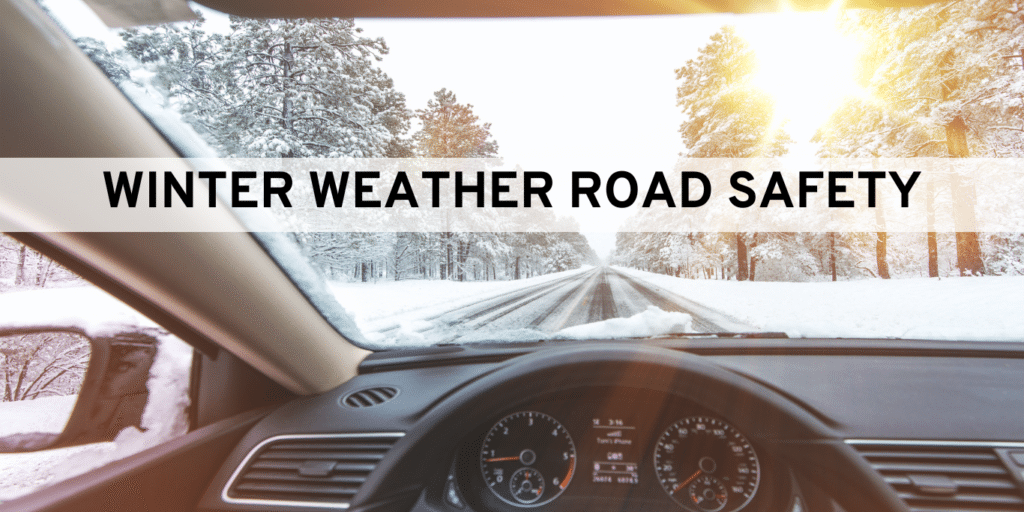 person driving in winter weather looking out windshield